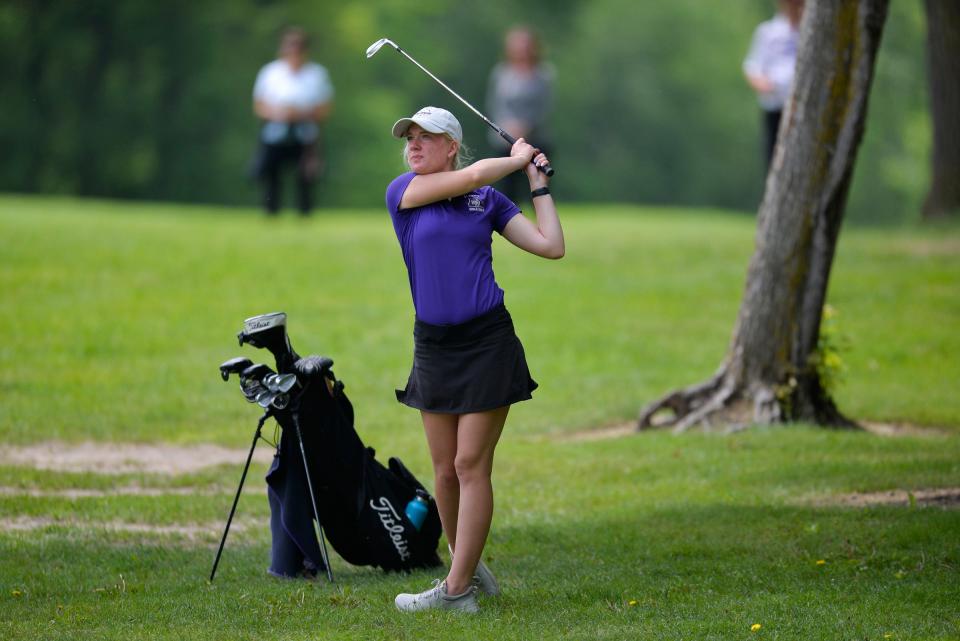 Albany's Abby Thelen follows through on a swing in the rough as Albany and Cathedral boys and girls golf compete in the Section 6-2A tournament on Tuesday, June 7, 2022, at Blackberry Ridge Golf Course in Sartell. 