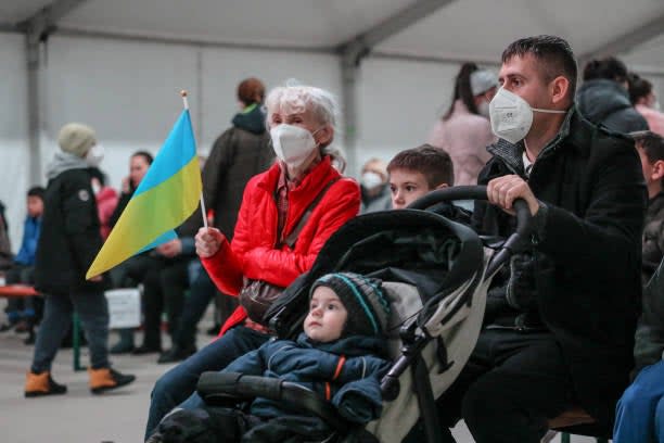 Volunteers in Santa costumes welcome refugees from Ukraine to an Epiphany event at the Tegel refugees registration center and temporary shelter on 7 January 2023 in Berlin, Germany (Getty Images)