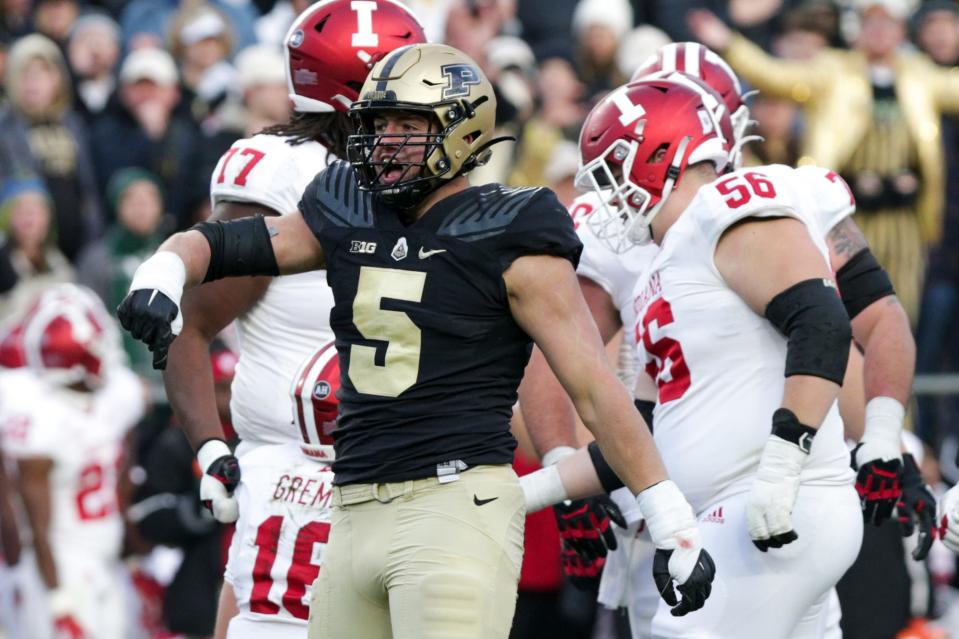 Purdue defensive end George Karlaftis (5) celebrates a stop during the second quarter of an NCAA college football game, Saturday, Nov. 27, 2021 at Ross-Ade Stadium in West Lafayette.