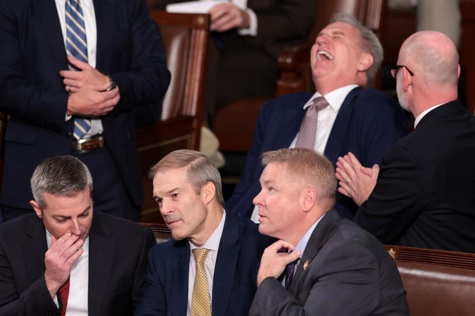 Representative Jim Jordan (R-OH) (C) talks to a staff member and Rep. Warren Davidson (R-OH) (R) while former Speaker of the House Kevin McCarthy (R-CA) laughs (Getty Images)