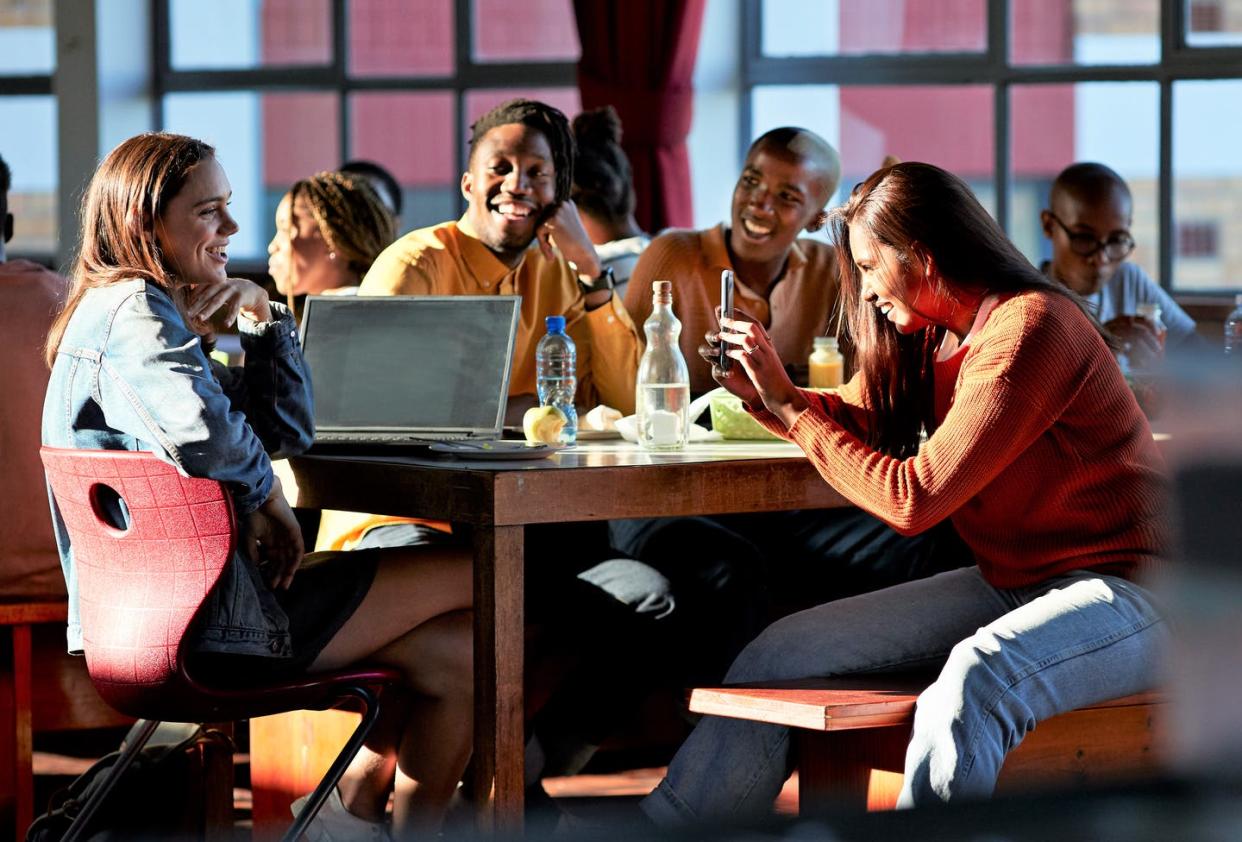 <span class="caption">Young people's attitudes toward alcohol have changed over the years. </span> <span class="attribution"><a class="link " href="https://www.gettyimages.com/detail/photo/cheerful-friends-enjoying-during-lunch-break-royalty-free-image/1170998115" rel="nofollow noopener" target="_blank" data-ylk="slk:Klaus Vedfelt via Getty Images;elm:context_link;itc:0;sec:content-canvas">Klaus Vedfelt via Getty Images</a></span>
