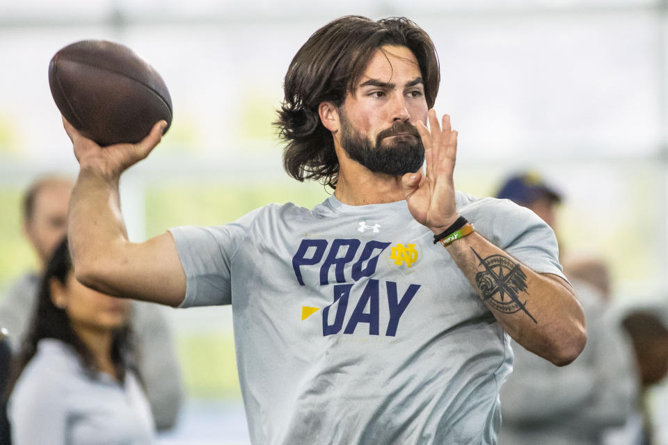 FILE -Notre Dame quarterback Sam Hartman runs a drill during NFL pro day football workouts in South Bend, Ind., Thursday, March 21, 2024. The Washington Commanders have signed former Notre Dame and Wake Forest quarterback Sam Hartman among 11 undrafted free agents. (AP Photo/Michael Caterina, File)
