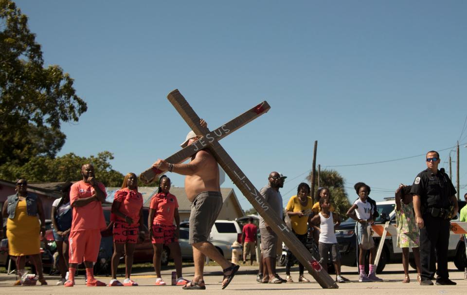 A man who said his name was Servant participates in the annual Dunbar Easter Parade on Sunday in Fort Myers. More than 700 people enjoyed floats, live music and dance performances. Local churches and city officials also took part in the event along Dr. Martin Luther King Jr. Boulevard. 