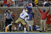 SMU wide receiver James Proche, top,, catches a touchdown pass while Tulsa safety Brandon Johnson (8) defends during the third overtime of an NCAA college football game Saturday, Oct. 5, 2019, in Dallas. SMU won 43-37. (AP Photo/Roger Steinman)