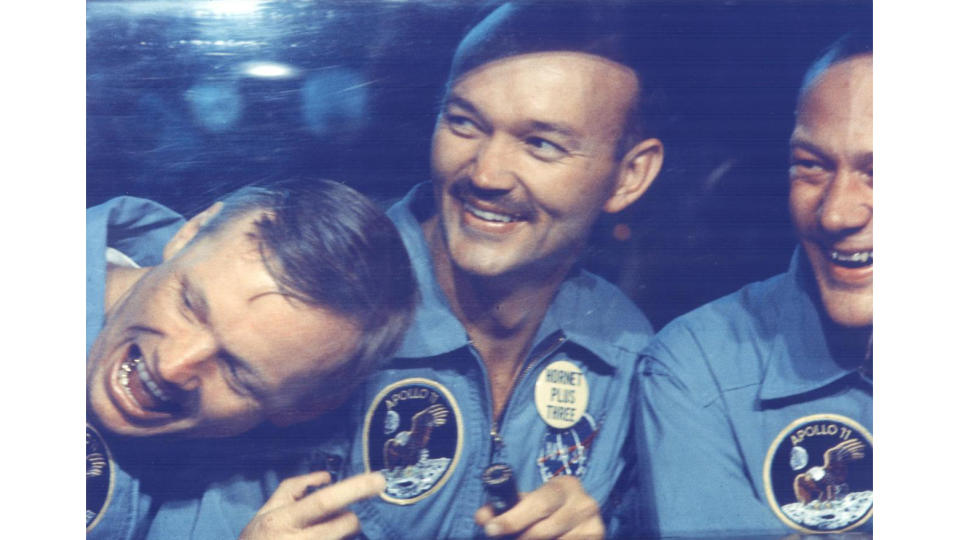 The Apollo 11 crew smiles in quarantine after their 1969 mission. From the left, astronauts Neil Armstrong, Michael Collins and Buzz Aldrin.