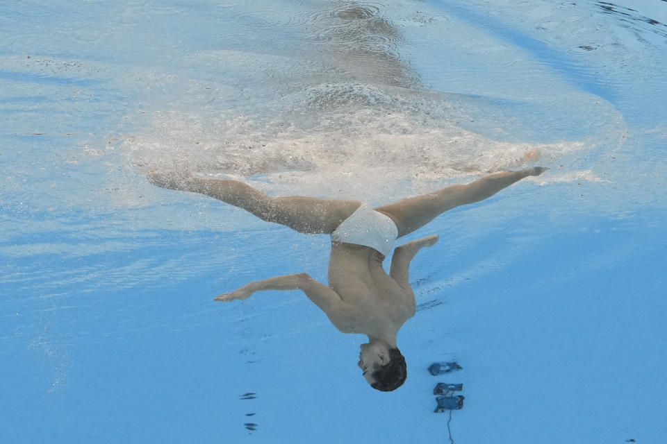Dennis Gonzalez Boneu, of Spain, competes in the men's solo free final of artistic swimming at the World Aquatics Championships in Doha, Qatar, Wednesday, Feb. 7, 2024. (AP Photo/Lee Jin-man)