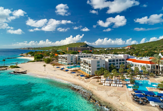 <p>Curaçao Marriott Beach Resort</p><p>This South American island is a paradise for couples wanting to spend an anniversary in the water. Explore below the surface and scuba dive with sea turtles, then relax on the white-sanded beaches. <a href="https://go.skimresources.com?id=113896X1572730&xs=1&url=https%3A%2F%2Fwww.tripadvisor.com%2FHotel_Review-g147278-d150663-Reviews-Curacao_Marriott_Beach_Resort-Willemstad_Curacao.html&sref=https%3A%2F%2Fparade.com%2F1002608%2Fmarynliles%2Fbest-anniversary-getaways%2F" rel="noopener" target="_blank" data-ylk="slk:Curaçao Marriott Beach Resort;elm:context_link;itc:0;sec:content-canvas" class="link ">Curaçao Marriott Beach Resort</a> provides couples in need of R&R with an ideal spot on oceanfront property.</p>