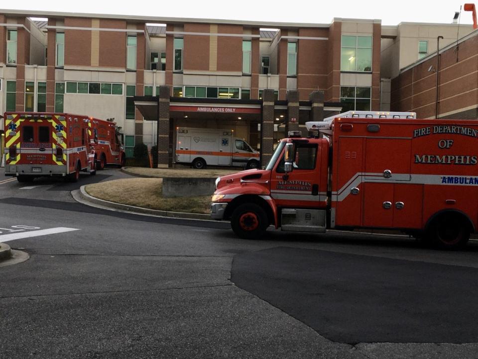 Parked ambulances from the Memphis Fire Department and other agencies fill the driveway near the ambulance entrance at Methodist Le Bonheur Germantown Hospital on the afternoon of Dec. 9 , 2020.