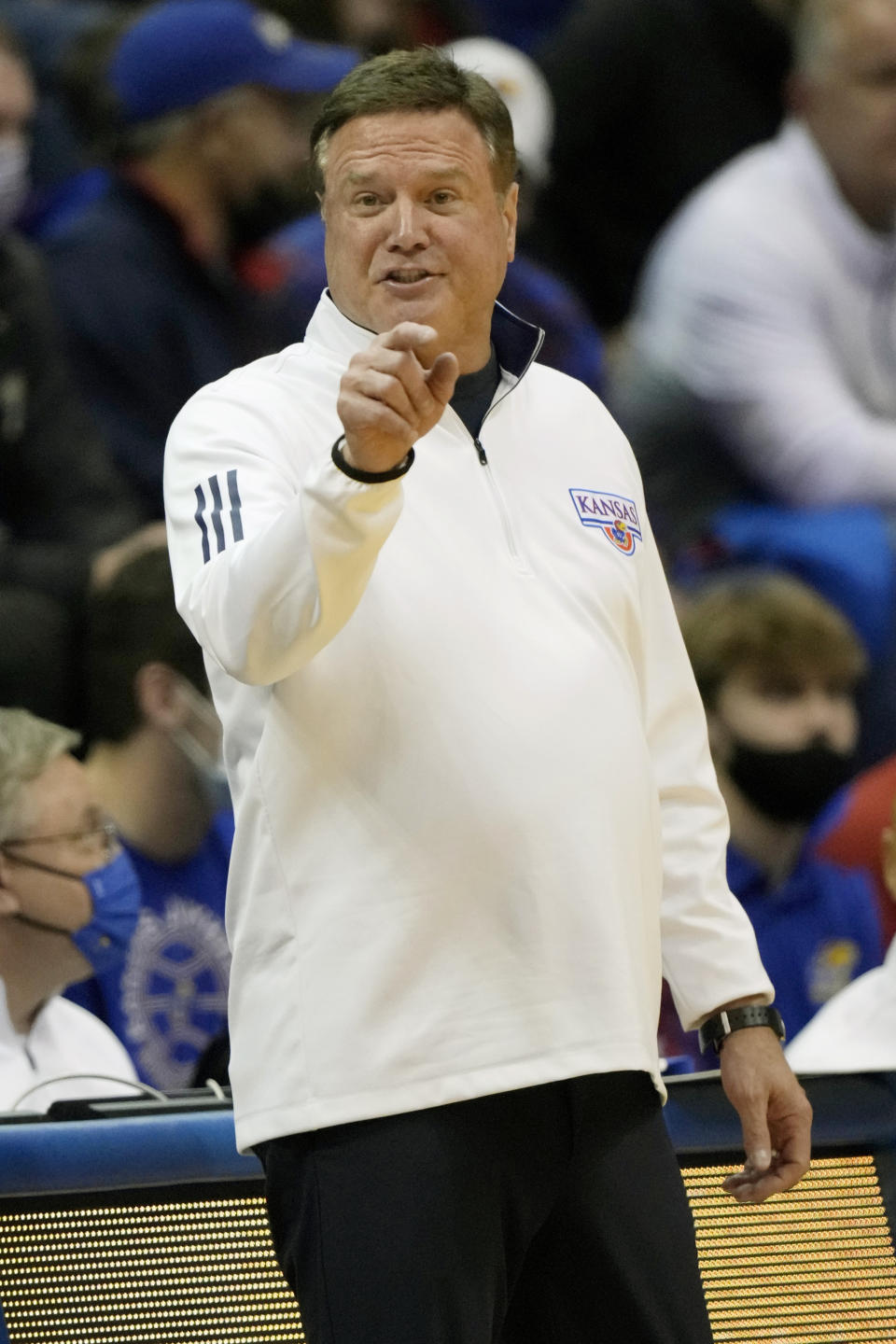 Kansas head coach Bill Self directs his team during the first half of an NCAA college basketball game against George Mason in Lawrence, Kan., Saturday, Jan. 1, 2022. (AP Photo/Orlin Wagner)