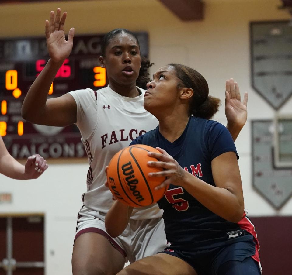 Ketcham's Nia Rencher (5) drives on Albertus' Mikaiya Beasley (31) in girls basketball action at Albertus Magnus High School in Bardonia on Thursday, Feb. 8, 2024.