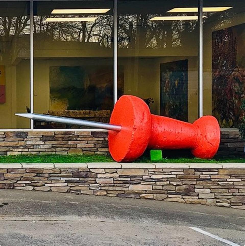 This 10-foot-long sculpture of a giant red thumbtack was stolen from outside the front entrance of its artist’s Hickory gallery late Tuesday, Feb. 27, 2024, or early Wednesday, Feb. 28.