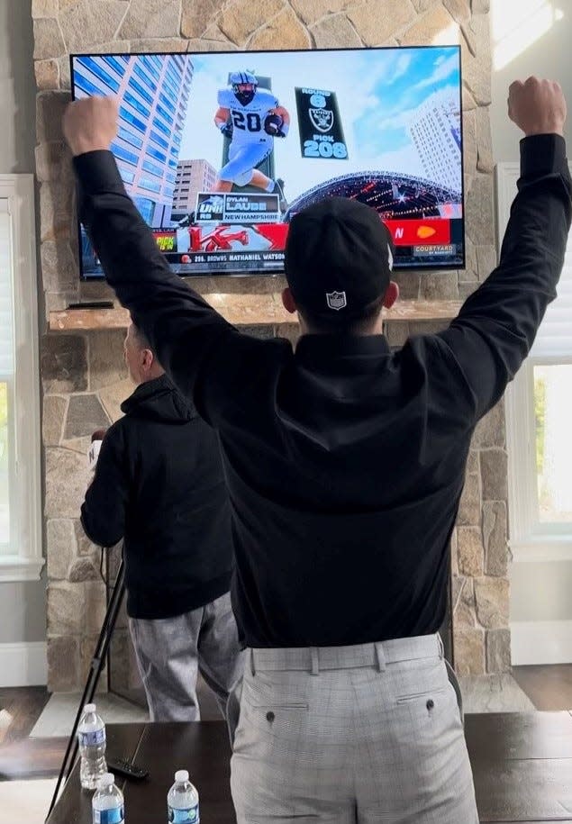 Uiversity of New Hampshire football standout Dylan Laube proudly wears a Las Vegas Raiders hat after being drafted by the AFC West team in the sixth round of last Saturday's NFL Draft.