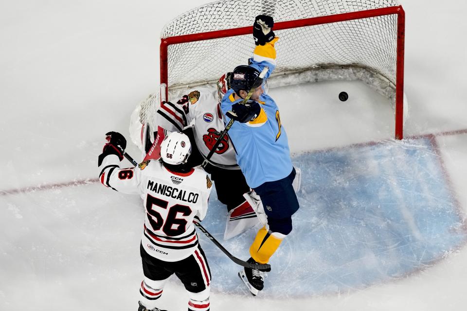 Milwaukee Admirals' Cody Hodgson reacts after scoring a goal against the Rockford Icehogs during an American Hockey League game Friday, March 1, 2024, in Milwaukee. Hodgson is a former NHL player who retired from hockey eight years ago due to a muscle disorder but is now making a comeback. (AP Photo/Morry Gash)