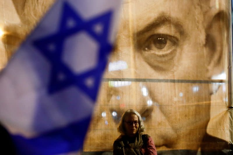 FILE PHOTO: Israelis protest Prime Minister Benjamin Netanyahu's new right-wing coalition and its proposed judicial reforms, in Tel Aviv