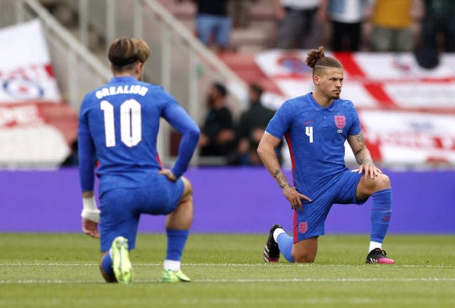 England players kneel before a match