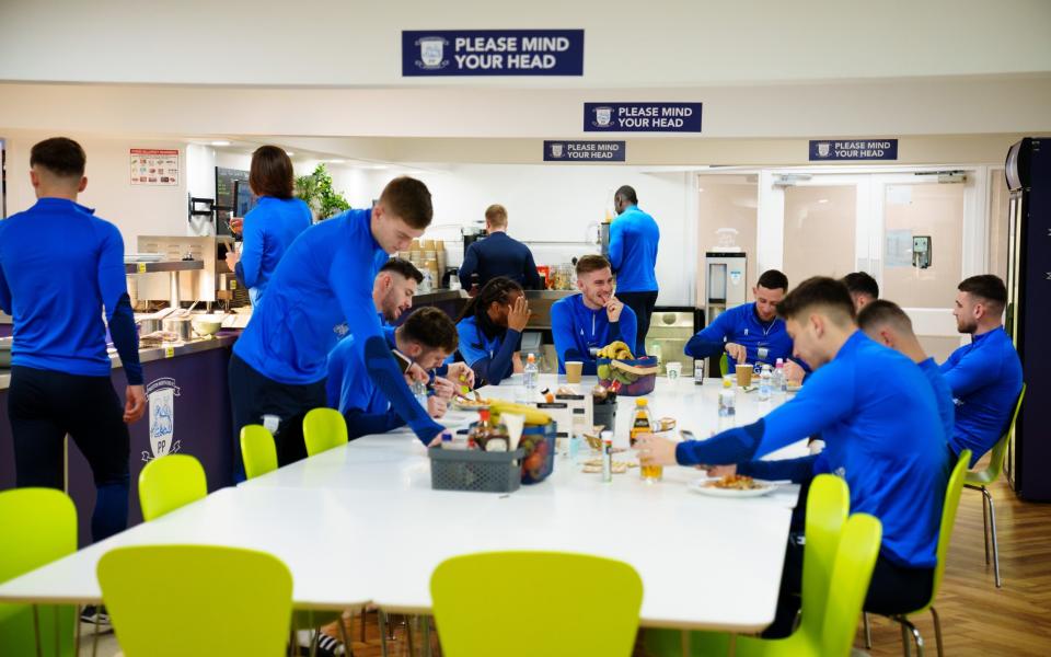 Preston players eat breakfast at their training ground at Euxton near Chorley - Jon Super