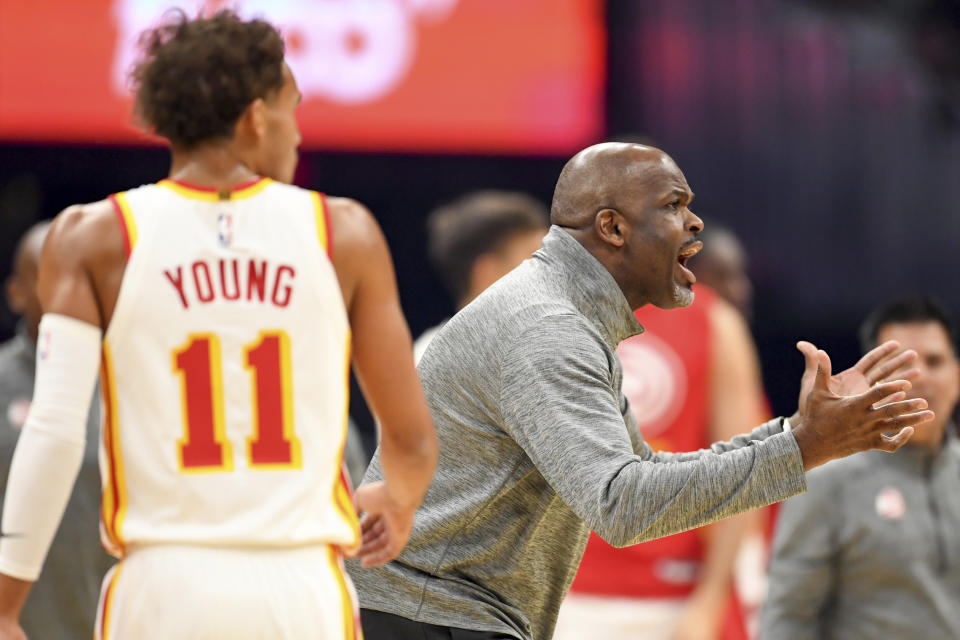 Atlanta Hawks head coach Nate McMillan argues a call during the first half of an NBA basketball game against the Cleveland Cavaliers, Monday, Nov. 21, 2022, in Cleveland. (AP Photo/Nick Cammett)