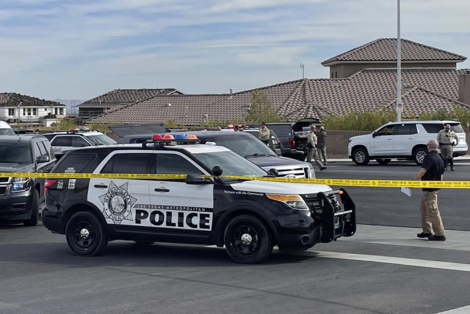 A SWAT team arrives to provide assistance as FBI agents negotiated with Matthew Beasley, who later was shot during the confrontation before being taken into custody, March 3, 2022 in Las Vegas. Beasley, a longtime Las Vegas attorney was indicted Wednesday on federal charges that he orchestrated a $460 million Ponzi scheme spanning multiple states, from Nevada and Utah to California and Arizona.(Bizuayehu Tesfaye/Las Vegas Review-Journal via AP)