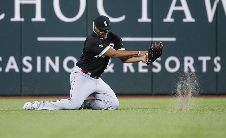 Chicago White Sox left fielder Eloy Jimenez fields a single by Texas Rangers' Nathaniel Lowe during the first inning of a baseball game, Saturday, Sept. 18, 2021, in Arlington, Texas. (AP Photo/Brandon Wade)