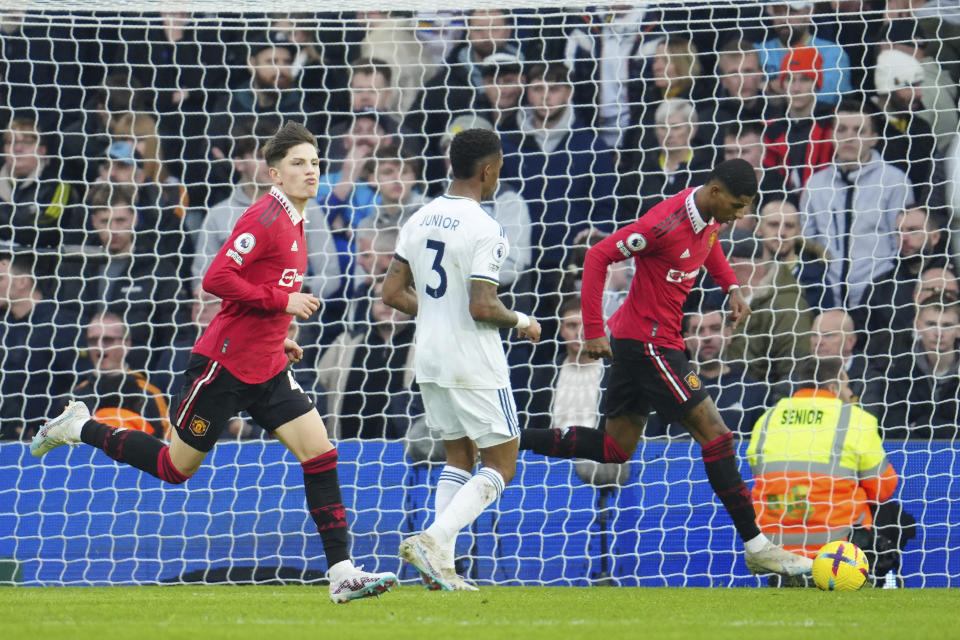 Manchester United's Alejandro Garnacho, left, celebrates with his teammate Marcus Rashford after scoring his side's second goal during the English Premier League soccer match between Leeds United and Manchester United at Elland Road, Leeds, England, Sunday, Feb.12, 2023. (AP Photo/Jon Super)