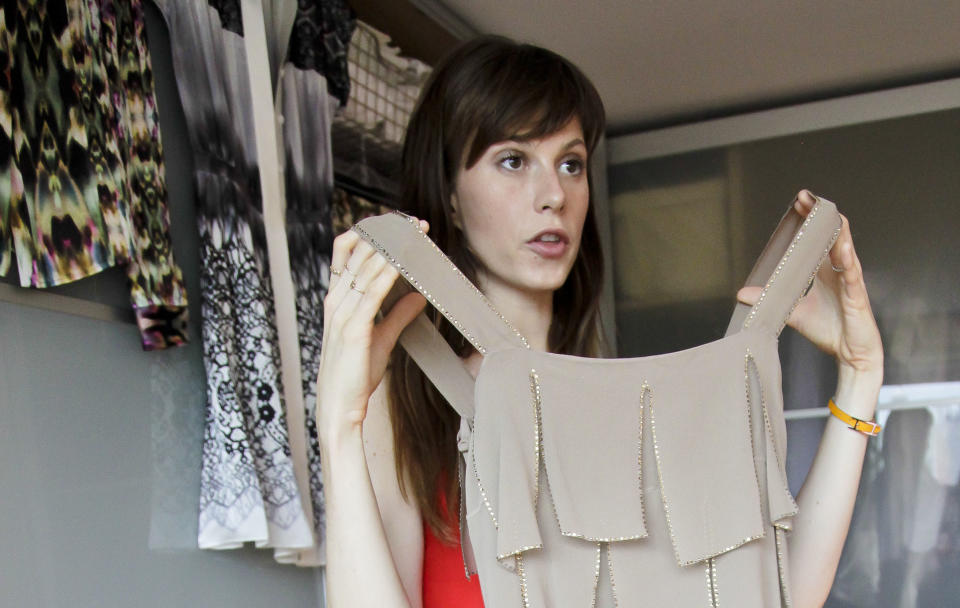 This Aug. 15, 2012 photo shows model Elettra Wiedemann showing off fashion from her closet at her apartment in New York. Wiedemann, daughter of Isabella Rossellini, landed on this year's Vanity Fair's International Best-Dressed dressed list. She's now keeping company with the Duchess of Cambridge, Diane Kruger and Jay-Z. (AP Photo/Bebeto Matthews)