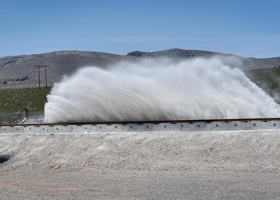 Sand is displaced as a test sled is slowed during the first test of the propulsion system at the Hyperloop One Test and Safety site on May 11, 2016, in North Las Vegas, Nevada. (David Becker/Getty Images)