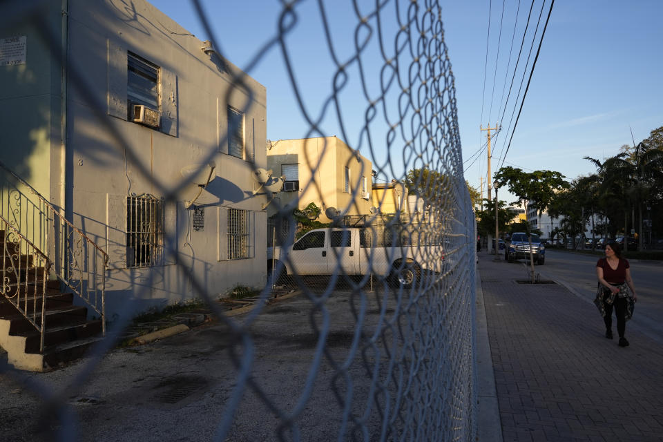 Vacant apartments are fenced off in the Miami neighborhood of west Coconut Grove, Thursday, Feb. 15, 2024. The majority-Black neighborhood — known by names such as West Grove, Black Grove, or even Little Bahamas, in a nod to its Bahamian roots — has nurtured the early careers of numerous notable sports figures. Today, few remnants of that proud Black heritage exist. Years of economic neglect followed by recent gentrification have wiped out much of the neighborhood’s cultural backbone. (AP Photo/Lynne Sladky)