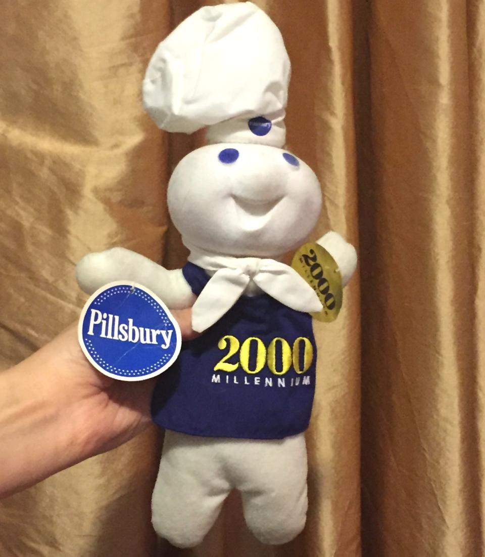 the pillsbury dough boy in a 2000 milennium shirt