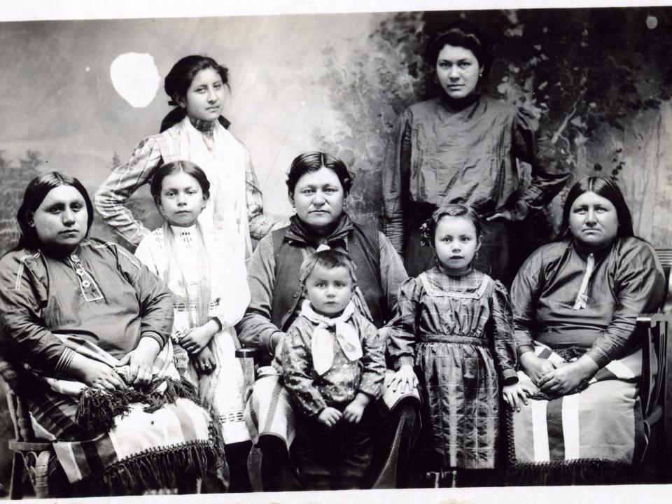 Postcard features a photograph of a group of unidentified women and children of the Osage Nation, Pawhuska, Oklahoma Territory, circa 1918 - 1922.