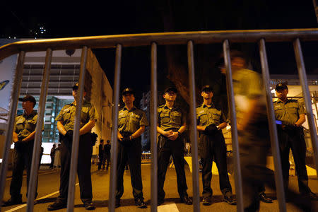 Officers from the Correctional Services Department stand guard outside a prison where student leaders Nathan Law and Alex Chow are jailed in Hong Kong, China August 18, 2017. REUTERS/Tyrone Siu