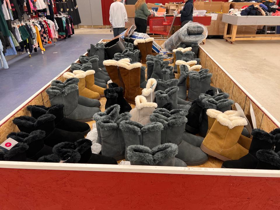 a bin full of winter boots at crazy hot deals