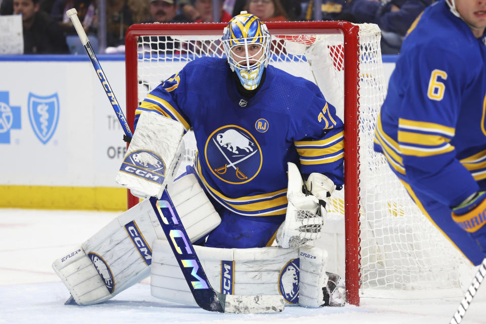 Buffalo Sabres goaltender Devon Levi hugs the post during the second period of the team's NHL hockey game against the Minnesota Wild on Friday, Nov. 10, 2023, in Buffalo N.Y. (AP Photo/Jeffrey T. Barnes)