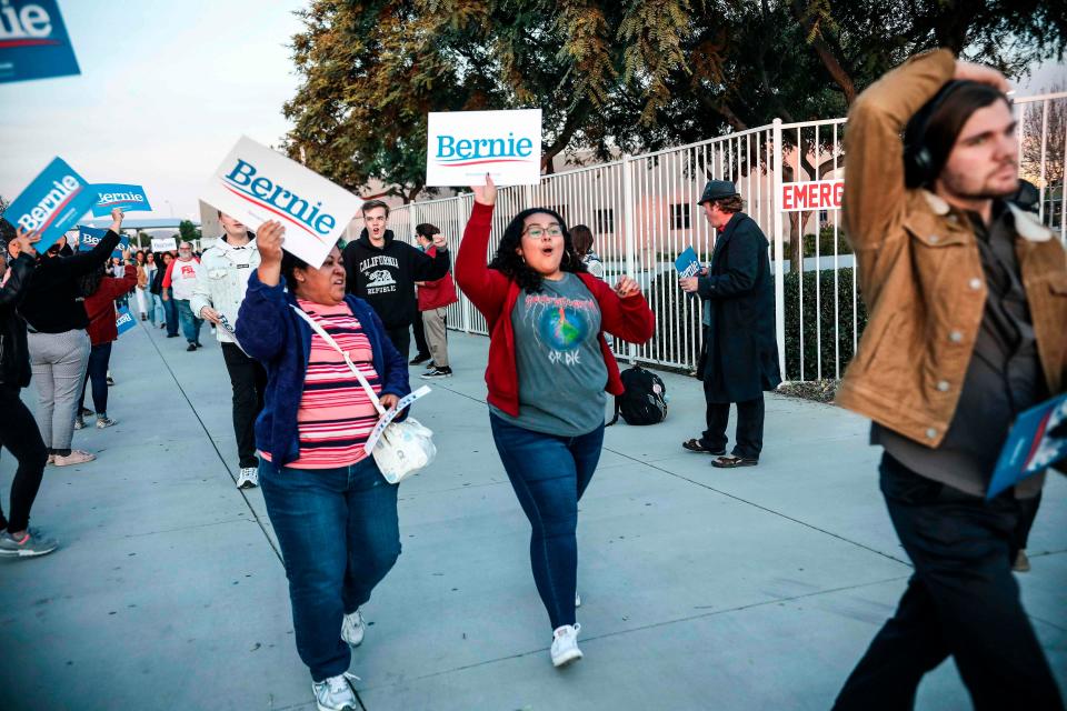 Supporters of Democratic presidential hopeful Vermont Senator Bernie Sanders enter an Immigration Town Hall in San Ysidro, California on December 20, 2019 at San Ysidro High School.