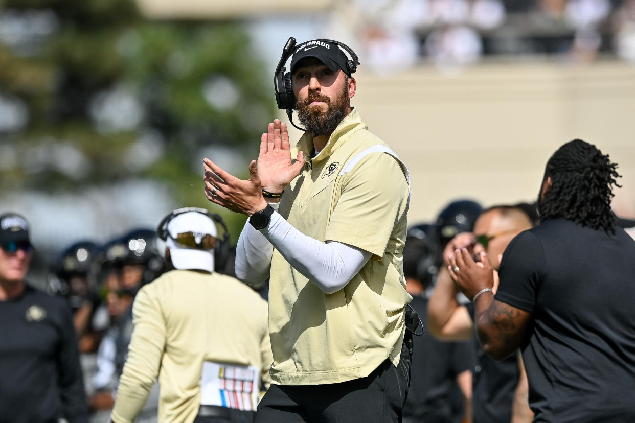 BOULDER, CO - SEPTEMBER 30:  Offensive coordinator Sean Lewis claps after an offensive touchdown in the fourth quarter against the USC Trojans at Folsom Field on September 30, 2023 in Boulder, Colorado. (Photo by Dustin Bradford/Getty Images)