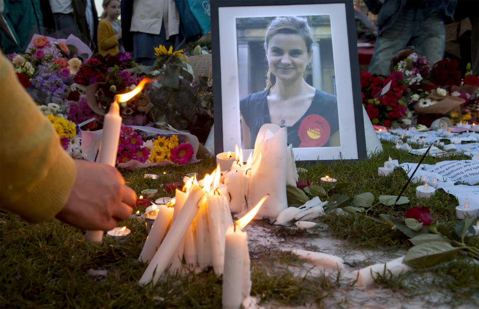  London, United Kingdom - June 17, 2016: Jo Cox's Vigil. A candlelit vigil was held in Parliament Square for the murdered MP, Jo Cox. People lit candles, left flowers, wrote messages and mourned.