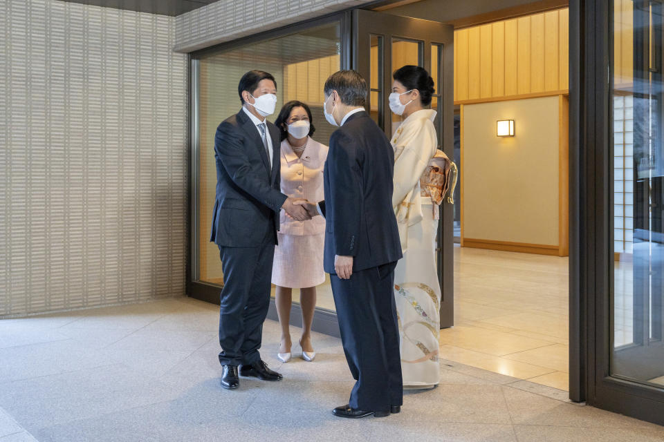 Philippine President Ferdinand Marcos Jr., left, shakes hands with Japan's Emperor Naruhito and his wife Louise Araneta-Marcos and Empress Masako look on at the Imperial Palace in Tokyo, Thursday, Feb. 9, 2023. (Imperial Household Agency of Japan via AP)