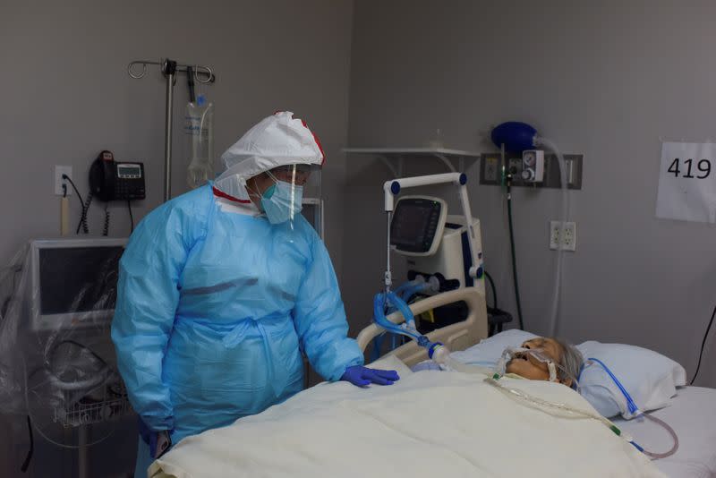 A woman says goodbye to her mother in a COVID-19 ICU in Houston