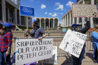 Union members demonstrators rally outside the Metropolitan Opera house during a "We Are the Met Rally," Thursday, May 13, 2021, in New York. Locked out stagehands and unions with contracts expiring this summer demonstrated outside the Met to protest the Opera's unfair treatment of workers, lockout of stagehands and the outsourcing of work. (AP Photo/Mary Altaffer)