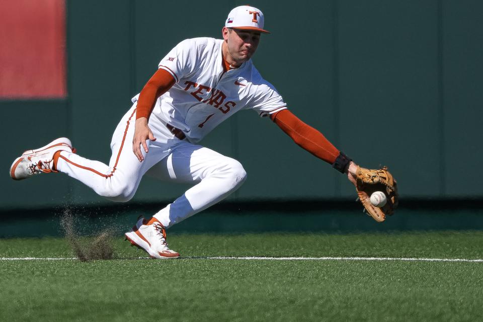 Jalin Flores secures a ground ball during the Longhorns' win over Cal Poly on Feb. 24 at UFCU Disch-Falk Field. Making the outstanding defensive play is becoming routine for Flores, in his first full season as the starting shortstop.