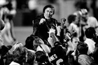 FILE - In this Jan. 23, 1984, file photo, coach Tom Flores gestures to members of the Los Angeles Raiders as they carry him off the field after their victory over the Washington Redskins in Super Bowl XVIII in Tampa, Fla. The AFL gave Flores one last chance when the fledging league launched in 1960 and Flores seized the opportunity. He became the original quarterback of the Raiders before going on to a trailblazing career as a coach and executive that landed him in the Pro Football Hall of Fame following a lengthy wait. (AP Photo/File)