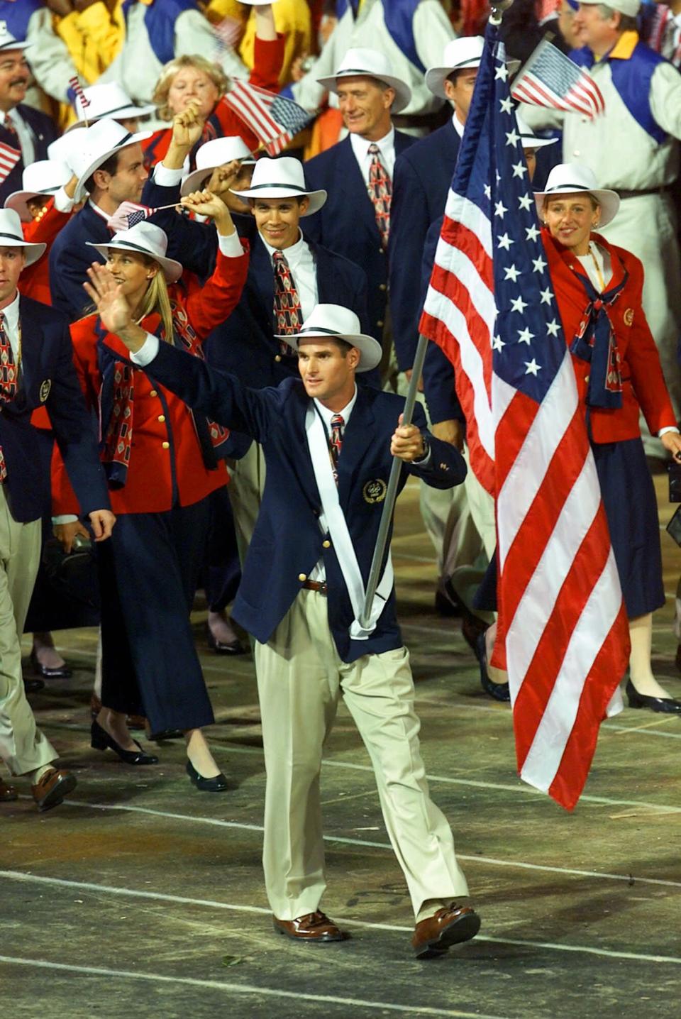 <p>Flag bearer Cliff Meidl and the rest of Team USA wore cowboy hats with their Opening Ceremony uniforms in 2000. (AP) </p>