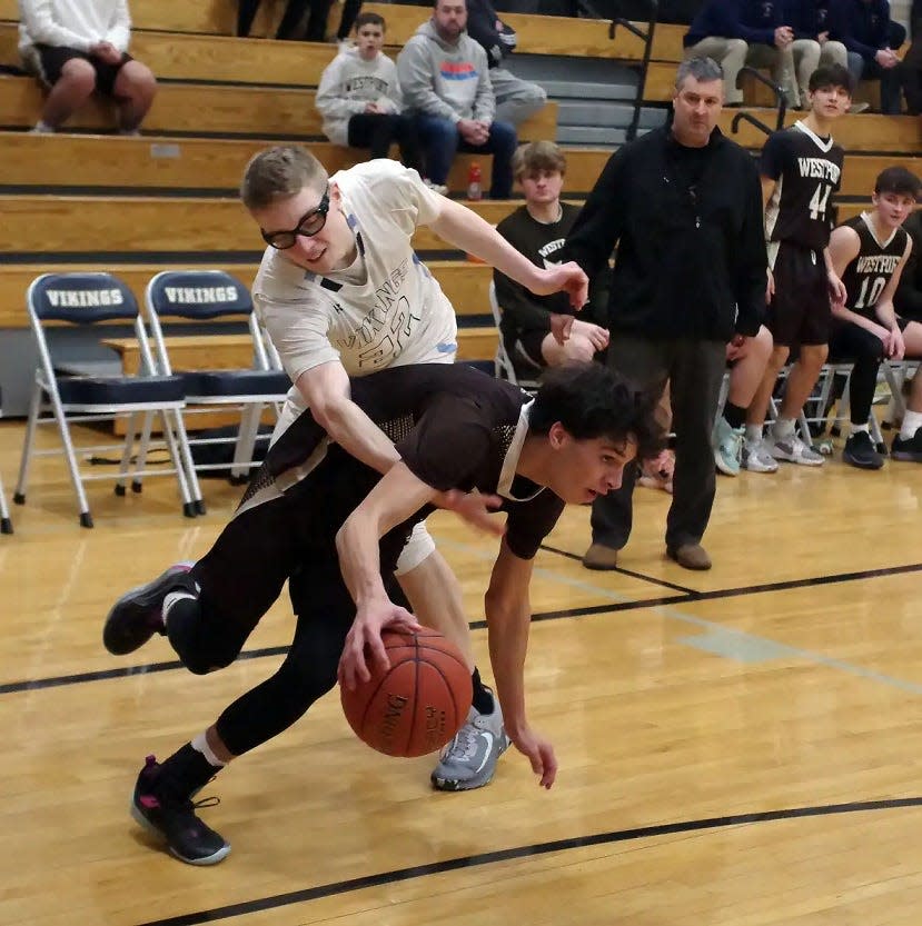 East Bridgewater's Aiden Flaherty tries to reach in for the ball against Westport's Own Boudria in the first half.