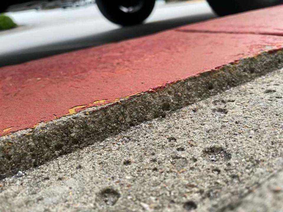 A channel or gap — about 3 inches wide and a half inch deep — lies between the sidewalk and curb in front of the Lexington County Auxiliary Administrative building. Courtesy The Goings Law Firm