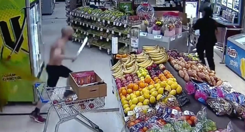 The shopper was shown running towards the alleged thief while holding a machete. Source: Nine News