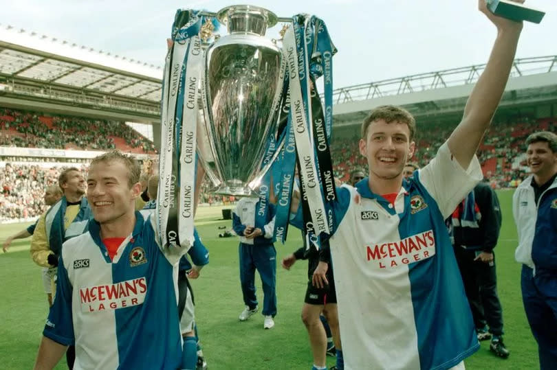 Blackburn Rovers strikers Chris Sutton and Alan Shearer celebrating with the Premier League title
