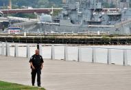 A police officer patrols outside the US Navy Yard September 16, 2013 in Washington, DC