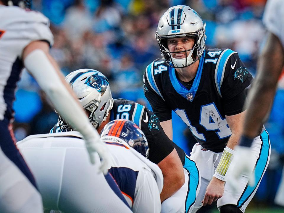 Sam Darnold looks up before a snap against the Denver Broncos.