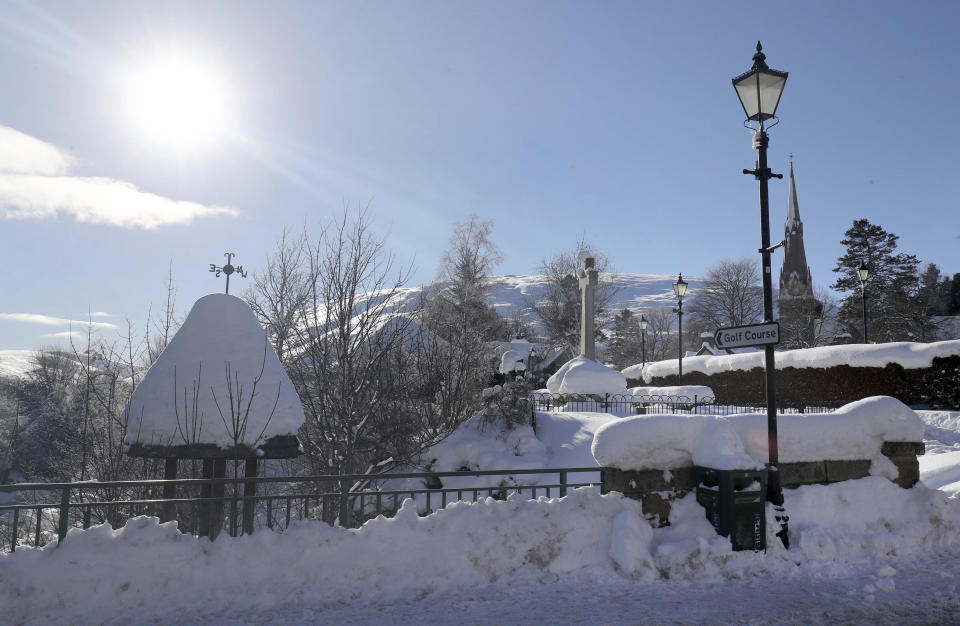 Snowy conditions in Braemar, Scotland, Thursday Feb. 11, 2021, which had an overnight temperature of minus 23.0C (minus 9.4F). The village, which is near Balmoral Castle, the summer residence of Queen Elizabeth II, recorded the lowest recorded temperature in the UK in more than two decades, following an "extreme freeze". (Jane Barlow/PA via AP)