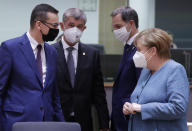 German Chancellor Angela Merkel, right, speaks with Poland's Prime Minister Mateusz Morawiecki, left, during a round table meeting at an EU summit at the European Council building in Brussels, Thursday, Oct. 1, 2020. European Union leaders are meeting to address a series of foreign affairs issues ranging from Belarus to Turkey and tensions in the eastern Mediterranean. (Olivier Hoslet, Pool via AP)