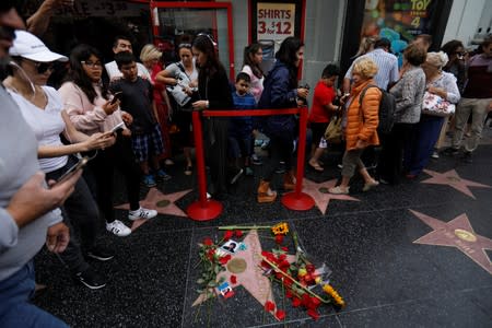 People walk past Michael Jackson's star on the Hollywood Walk of Fame ten years after the death of child star turned King of Pop in Los Angeles, California